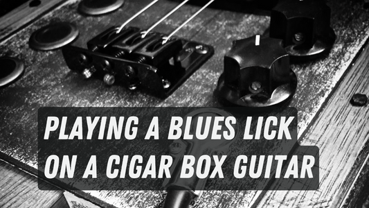Playing a Blues Lick on a Cigar Box Guitar